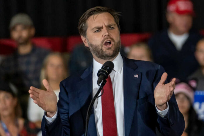 54801cb8-0515-4c34-a2d8-f79705e6683e_shutterstock2542628059jpg.jpeg Man in suit speaking at a podium