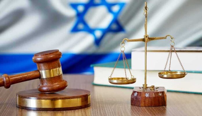 shutterstock_1034812465 Gavel and scales of justice with Israeli flag in background