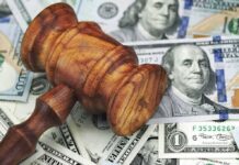 System Failure or Cover-Up? Wooden judge's gavel on scattered US dollar bills
