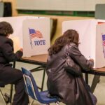 Feds Nab Voter Fraud Suspect in L.A. Voters filling out ballots at polling booths
