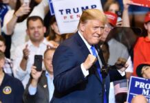 Trump Brings Iran Fight To UN Donald Trump at a rally raising his fists on stage