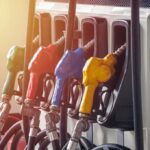 Diesel Surge Threatens Grocery Bills Fuel pump nozzles in multiple colors at a gas station