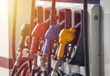 Diesel Surge Threatens Grocery Bills Fuel pump nozzles in multiple colors at a gas station