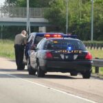 Ohio Death Sparks License Policy Fight Police officer conducting a traffic stop on a highway