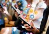 people using smartphones with social media reactions