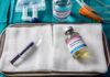 Assisted-Dying Standoff Ignites In Illinois Medical tray with syringe and pentobarbital vials on gauze