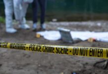 Deadly Misfire: Mom Mistaken For Deer Police crime scene with yellow tape and forensic team