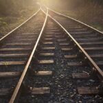 Emergency Slams SoCal Rail Lifeline Railway tracks converging into the distance at sunset