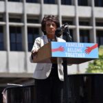 speaker at outdoor rally podium