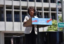 speaker at outdoor rally podium