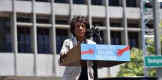 speaker at outdoor rally podium