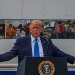 Trump Torpedoes Iran’s 7‑Day Gambit Donald Trump speaks at a podium with arms outstretched