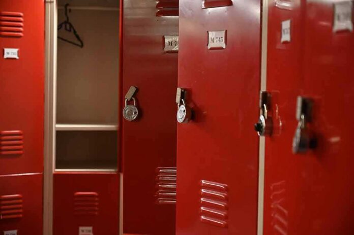 shutterstock_1862930638 Red metal lockers with combination locks