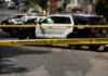 Wrong-Way Crash Leads To Two Murder Charges Police tape cordoning off street with patrol SUVs behind