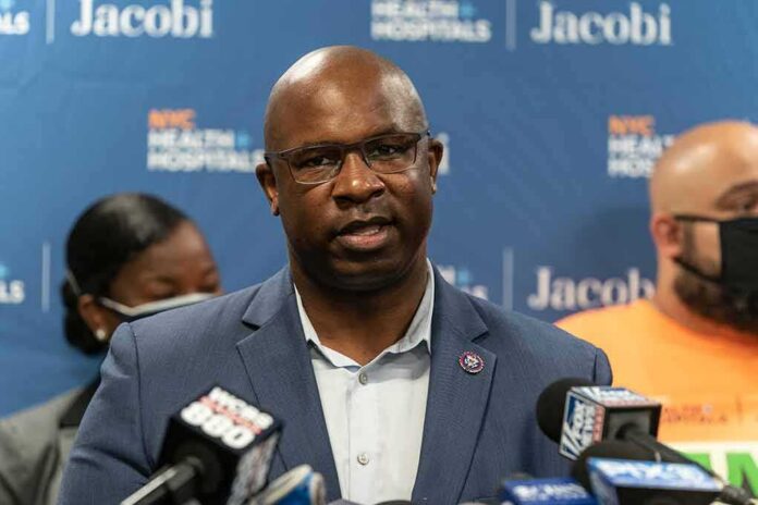 Man in suit speaking at a press conference