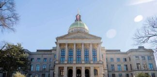 State capitol building with gold dome and columns
