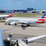 Midair Mayhem Forces Emergency Detour American Airlines jets taxi at a busy airport apron