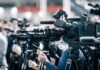 AOC Invokes God At Baptist Convention Broadcast cameras on tripods at a press event