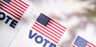 American flag vote posters on a table