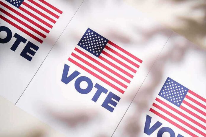 shutterstock_2317102917 American flag vote posters on a table