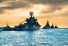 Pacific Kill Count Keeps Climbing Naval warships anchored in a harbor at sunset