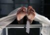AOC’s Number Collides With Autopsies Human feet with toe tag on a morgue gurney