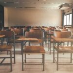 Discord Kill List Sparks School Lockdowns Empty classroom with rows of wooden desks and chairs