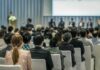 Backlash Erupts Over ‘Deterrence’ Push Bill Kenney at a conference panel with an audience