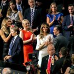 Tiffany Trump, Melania Trump, and Donald Trump Jr. among a crowd applauding at an event
