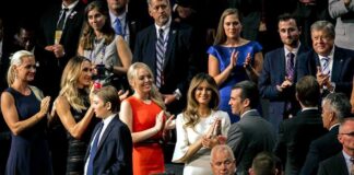 Tiffany Trump, Melania Trump, and Donald Trump Jr. among a crowd applauding at an event