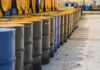 Trump Greenlights Tax-Free Highway Diesel Rows of industrial metal barrels with yellow lids