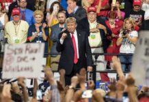 Crowd Gasps As Pardons Roll Out Donald Trump at a rally with Lauri Marjamäki and Elizaveta Glinka in the crowd