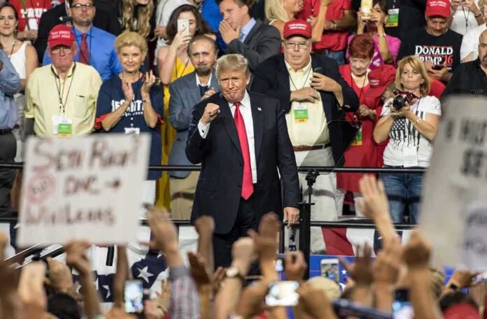 shutterstock_1147142282 Donald Trump at a rally with Lauri Marjamäki and Elizaveta Glinka in the crowd