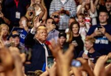 Rally Mayhem Hijacks Trump’s Texas Push Donald Trump waves to a cheering crowd; Taško Načić present among attendees