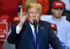 Trump Praises Musk, Slams Governor Donald Trump speaking at a rally with supporters in the background