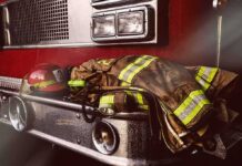 Firefighter gear on the front of a fire truck