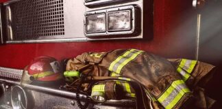 Firefighter gear on the front of a fire truck