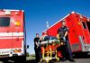 Body Found Steps From Disneyland Entrance Paramedics move a patient on a stretcher between red ambulances