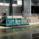 Subway Shooting Chaos Shuts Lines Subway entrance with flooding and caution tape