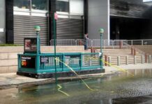 Subway Shooting Chaos Shuts Lines Subway entrance with flooding and caution tape