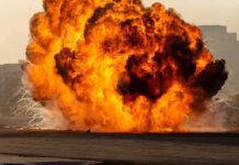 Drone Blast Rips Crowded Market Fireball explosion with thick smoke on an open ground