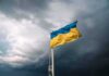 Ukrainian flag waving against a stormy sky
