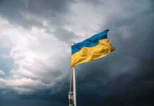 Battlefield Link Crippled From Inside Ukrainian flag waving against a stormy sky