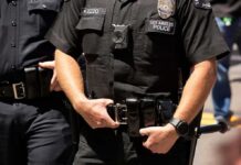 LAPD Chief On The Chopping Block Police officers in black uniforms with duty belts