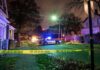Resort Bloodbath Shocks Great Wolf Lodge Police car blocks residential street at night behind caution tape