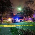 Resort Bloodbath Shocks Great Wolf Lodge Police car blocks residential street at night behind caution tape