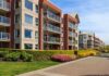 UGA Student Survives Eight-Story Fall Modern apartment buildings with balconies and landscaped gardens on a sunny day