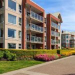 UGA Student Survives Eight-Story Fall Modern apartment buildings with balconies and landscaped gardens on a sunny day