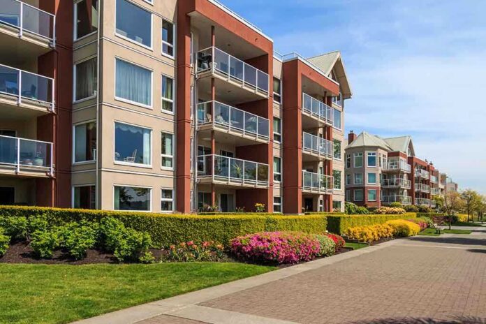 shutterstock_191081627 Modern apartment buildings with balconies and landscaped gardens on a sunny day