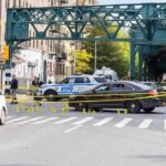 Coked-Up Crash Exposes Court Failure Police cars block a city intersection with yellow crime scene tape
